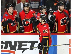 Calgary Flames forward Andrew Mangiapane celebrates with teammates after scoring against the Ottawa Senators in NHL hockey at the Scotiabank Saddledome in Calgary on Thursday.