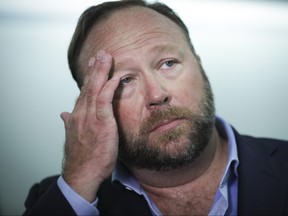 Alex Jones of InfoWars talks to reporters outside a Senate Intelligence Committee hearing concerning foreign influence operations' use of social media platforms, on Capitol Hill, Sept. 5, 2018 in Washington, D.C. (Drew Angerer/Getty Images)