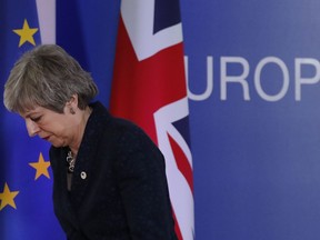 British Prime Minister Theresa May leaves after addressing a media conference at an EU summit in Brussels, Friday, March 22, 2019. Worn down by three years of indecision in London, EU leaders on Thursday were grudgingly leaning toward giving the U.K. more time to ease itself out of the bloc.