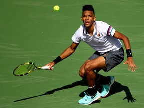 Felix Auger-Aliassime plays a forehand against Stefanos Tsitsipas during their BNP Paribas Open match at the Indian Wells Tennis Garden on March 09, 2019 in Indian Wells, California. (Clive Brunskill/Getty Images)