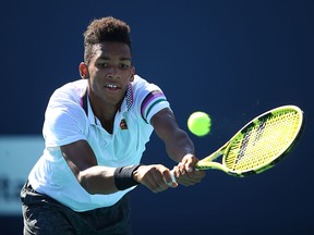 Felix Auger-Aliassime returns a shot against Paolo Lorenzi in qualifying for the Miami Open on March 20, 2019 in Miami Gardens, Florida. (Julian Finney/Getty Images)