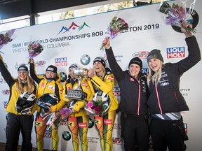 Germany's Mariama Jamanka, third left, and Annika Drazek, fourth left, hold the trophy after winning the women's bobsleigh event while posing with Germany's Ann-Christin Strack, left, and Stephanie Schneider, second left, who finished second, and Canada's Christine de Bruin, second right, of Stony Plain, Alta., and Kristen Bujnowski, right, of Moose Jaw, Sask., who finished third, at the Bobsleigh World Championships in Whistler, B.C., on Sunday March 3, 2019.