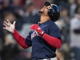 The Boston Red Sox's Xander Bogaerts celebrates after hitting a home run Friday, March 29, 2019, in Seattle.