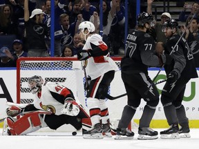 Lightning defenceman Victor Hedman celebrates with teammate Alex Killorn after scoring on Sens goaltender Craig Anderson during the first period on Saturday night in Tampa.