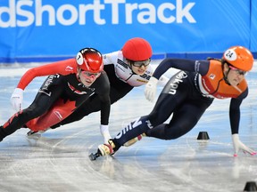 Korea's Min Jeong Choi, centre, reacts as she competes with Netherland's Suzanne Schulting. right, and Canada's Kim Boutin during Ladies 1000-metre final, at the ISU World Short Track Speed Skating Championships in Sofia, Bulgaria, on Sunday, March 10, 2019.