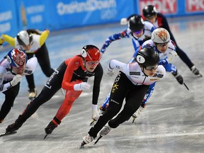 South Korea's Min Jeong Choi, centre, competes, followed by Sofia Prosvirnova of Russia, right, and Canada's Kim Boutin, left, during Ladies 1500m final, at the ISU World Short Track Speed Skating Championships in Sofia, Bulgaria,, on Saturday, March 9, 2019.