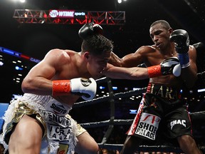 Erislandy Lara punches Brian Castano during their WBA "regular" junior middleweight title fight at Barclays Center on March 2, 2019 in New York City.