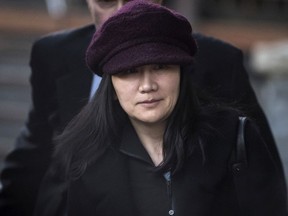 In this Jan. 29, 2019, file photo, Huawei chief financial officer Meng Wanzhou leaves her home to attend a court appearance in Vancouver, British Columbia.