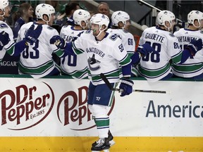 Tim Schaller celebrates with the bench after scoring a goal against the Dallas Stars in the first period.