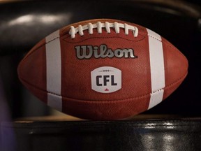 A football with the new CFL logo sits on a chair in Winnipeg, Nov. 27, 2015.