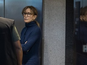 Desperate indeed! Felicity Huffman looks more like a common criminal at a Boston courthouse after being charged in a massive exam cheating scandal.