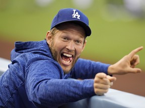 In this May 25, 2018, file photo, Los Angeles Dodgers pitcher Clayton Kershaw jokes around in the dugout prior to a game against the San Diego Padres in Los Angeles. (AP Photo/Mark J. Terrill, File)