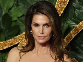 Cindy Crawford poses on the red carpet upon arrival to attend the British Fashion Awards 2018 in London on Dec. 10, 2018.