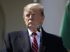 President Donald Trump listens during a news conference with Brazilian President Jair Bolsonaro in the Rose Garden of the White House, Tuesday, March 19, 2019, in Washington.