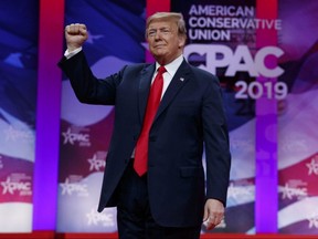 U.S. President Donald Trump gestures to the cheering audience as he arrives to speak at the Conservative Political Action Conference, CPAC 2019, in Oxon Hill, Md., Saturday, March 2, 2019.
