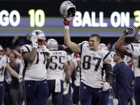 In this Feb. 3, 2019, file photo, New England Patriots' Rob Gronkowski celebrates with teammates after the NFL Super Bowl 53 football game against the Los Angeles Rams in Atlanta.