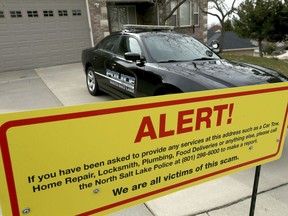 A warning sign and a police officer's vehicle are stationed at Walt Gilmore's home on Thursday, March 21, 2019.
