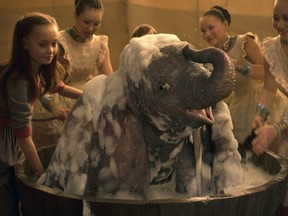 This image released by Disney shows Nico Parker, left, in a scene from "Dumbo." (Disney via AP)
