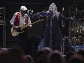 Bassist John McVie, left, and singer/songwriter Stevie Nicks perform onstage with Fleetwood Mac at the Capital One Arena in Washington, D.C., on March 5, 2019.