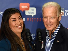 In this Nov. 1, 2014, file photo, Democratic candidate for lieutenant governor and current Nevada Assemblywoman Lucy Flores (D-Las Vegas) (L) introduces U.S. Vice-President Joe Biden at a get-out-the-vote rally at a union hall in Las Vegas.
