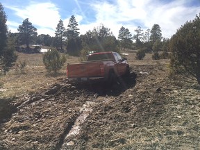 This March 2019 photo provided by the Coconino County Sheriff's Office shows a vehicle belonging to Ryan Long near Happy Jack, Ariz. Long, 38, who likely died from exposure while stranded in Arizona might have survived if he had not rejected rescue efforts because he was afraid of being arrested, authorities said Tuesday, March 19, 2019.