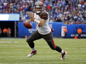In this Nov. 18, 2018, file photo, Tampa Bay Buccaneers quarterback Ryan Fitzpatrick rushes for a touchdown against the New York Giants during an NFL football game in East Rutherford, N.J.