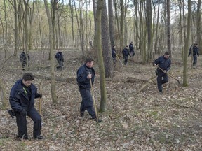 Berlin police search a forest in Kummersdorf, Germany, for a girl who went missing in Berlin last month, on Thursday, March 7, 2019.