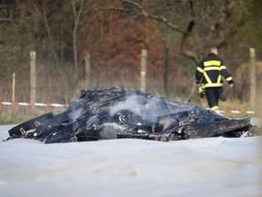 The burnt out debris of a small aircraft lies on a field near the small airport of Egelsbach near Frankfurt, Germany, Sunday, March 31, 2019.