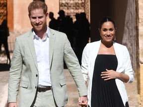 Prince Harry, Duke of Sussex, and Meghan, Duchess of Sussex, walk through the walled public Andalusian Gardens which has exotic plants, flowers and fruit trees during a visit on Feb. 25, 2019 in Rabat, Morocco.  (Facundo Arrizabalaga - Pool/Getty Images)
