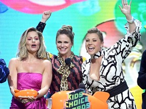 Candace Cameron-Bure, left, Andrea Barber, centre, and Jodie Sweetin accept the Favorite Funny TV Show award for 'Fuller House' onstage at Nickelodeon's 2019 Kids' Choice Awards at Galen Center on March 23, 2019 in Los Angeles, Calif.  (Kevin Winter/Getty Images)