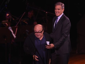 Danny DeVito, left, and George Clooney perform on stage at SeriousFun Children's Network's New York City Gala at Avery Fisher Hall, Lincoln Center on March 2, 2015 in New York City.  (Dimitrios Kambouris/Getty Images)