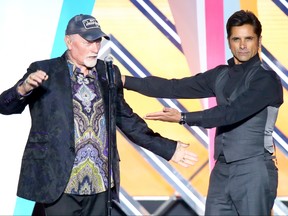Musician Mike Love of the Beach Boys and actor John Stamos are seen onstage after performing at the 2016 TV Land Icon Awards at The Barker Hanger on April 10, 2016 in Santa Monica, Calif.  (Mark Davis/Getty Images for TV Land)