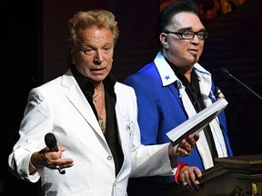 Siegfried Fischbacher, left, and Roy Horn speak during Criss Angel's HELP (Heal Every Life Possible) charity event at the Luxor Hotel and Casino benefiting pediatric cancer research and treatment on Sept. 12, 2016 in Las Vegas.  (Ethan Miller/Getty Images)