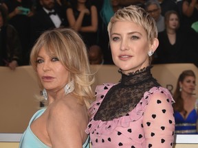 Actresses Goldie Hawn and Kate Hudson arrive for the 24th Annual Screen Actors Guild Awards at the Shrine Exposition Center on January 21, 2018, in Los Angeles, California.