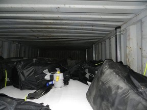 This March 2019 image provided by U.S. Customs and Border Protection shows large duffle bags containing cocaine that were seized in a shipping container at the Philadelphia seaport. (U.S. Customs and Border Protection via AP)