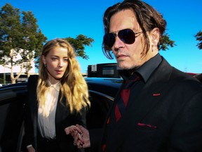 Johnny Depp, right, and Amber Heard arrive at a court in the Gold Coast on April 18, 2016.