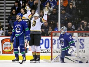 Vegas Golden Knights' Tomas Nosek (92) celebrates his goal near Vancouver Canucks goaltender Jacob Markstrom (25) during first period NHL hockey action in Vancouver on Saturday, March 9, 2019.