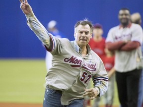 Former Montreal Expos pitcher John Wetteland throws out the first pitch before a spring training game between the Toronto Blue Jays and St. Louis Cardinals on March 26, 2018 in Montreal.