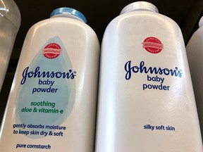 Containers of Johnson's baby powder made by Johnson and Johnson are displayed on a shelf on July 13, 2018 in San Francisco.