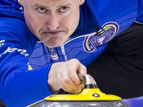 Team Alberta skip Kevin Koe makes a shot during the sixth draw against team New Brunswick at the Brier in Brandon, Man. Monday, March, 4, 2019. THE CANADIAN PRESS/Jonathan Hayward