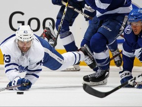 Mathieu Joseph (7) of the Tampa Bay Lightning draws a penalty for tripping Nazem Kadri of the Maple Leafs on Monday night at Scotiabank Arena. (Claus Andersen/Getty Images)