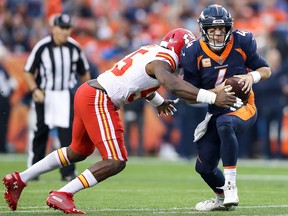 Quarterback Case Keenum of the Denver Broncos is sacked by linebacker Dee Ford of the Kansas City Chiefs at Broncos Stadium at Mile High on October 1, 2018 in Denver. (Matthew Stockman/Getty Images)