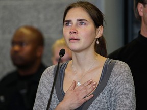 In this Oct. 4, 2011 file photo Amanda Knox gestures at a news conference in Seattle, after returning home from Italy.
