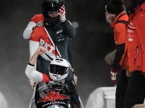 Canada's Justin Kripps, Ryan Sommer, Cameron Stones and Ben Coakwell celebrate after racing to a third place finish during the four-man bobsleigh event at the Bobsleigh World Championships in Whistler, B.C., on Saturday, March 9, 2019.