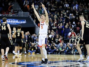 Kyle Guy of the Virginia Cavaliers celebrates after defeating the Purdue Boilermakers to advance to the Final Four in overtime of the 2019 NCAA Men's Basketball Tournament South Regional at KFC YUM! Center on March 30, 2019 in Louisville, Ky.