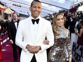 In this Sunday, Feb. 24, 2019, file photo, Alex Rodriguez, left, and Jennifer Lopez arrive at the Oscars at the Dolby Theatre in Los Angeles. (Charles Sykes/Invision/AP, File)