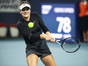 Bianca Andreescu, of Canada, returns a shot to Angelique Kerber, of Germany, during the Miami Open tennis tournament Sunday, March 24, 2019, in Miami Gardens, Fla.