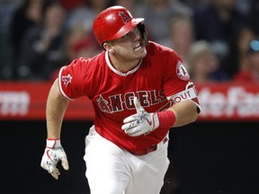 Los Angeles Angels' Mike Trout reacts after hitting a fly ball during the fourth inning of a game against the Houston Astros, Monday, May 14, 2018, in Anaheim, Calif.
