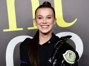 British actress Millie Bobby Brown poses during a photo call as she arrives to attend the Moncler women's Fall/Winter 2019/2020 collection fashion show in Milan on Feb. 20, 2019.