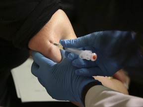 A woman receives a measles, mumps and rubella vaccine at the Rockland County Health Department in Pomona, N.Y., Wednesday, March 27, 2019.